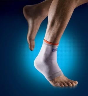 A person wearing a Thuasne Elastic Ankle Support