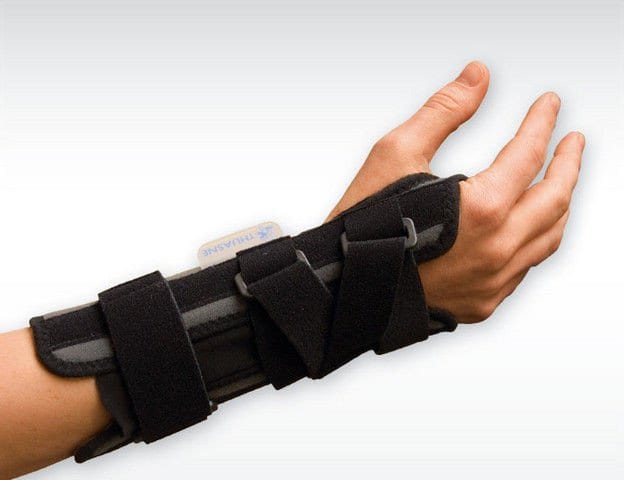 A person wearing a Thuasne Ligaflex Classic Wrist Support on their hand